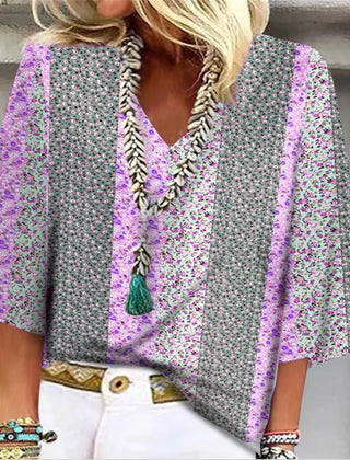 Multicolor floral-print blouse with V-neck tassel trim and flared sleeves