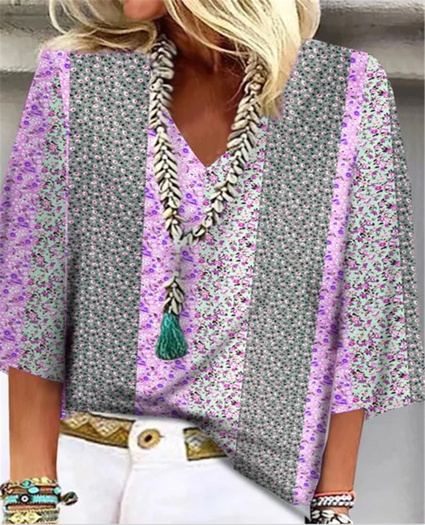 Multicolor floral-print blouse with V-neck tassel trim and flared sleeves