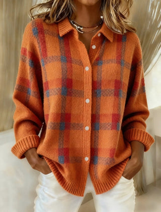 Orange plaid knit vest with V-neck, button front, long sleeves, ribbed cuffs.