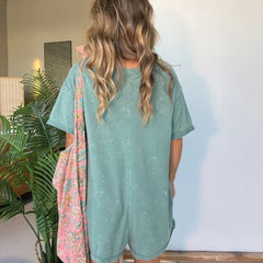 Washed gray-green short-sleeve V-neck romper with relaxed fit and patch pockets