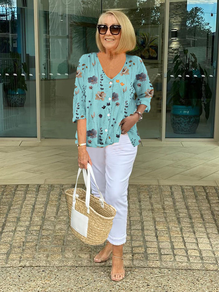 Printed button tunic top in sky blue with floral pattern, three-quarter sleeves