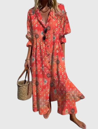 Red bohemian dress with ornate print, V-neck, short sleeves, flared ruffle hem