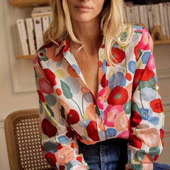 Colorful floral blouse front view with spread collar and button cuffs