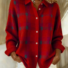 Red plaid knit vest with V-neck, button front, long sleeves, ribbed cuffs.