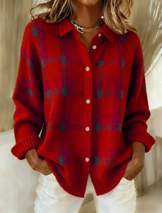 Red plaid knit vest with V-neck, button front, long sleeves, ribbed cuffs.