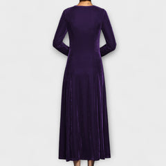 Purple soft velvet dress back view with long sleeves and midi length flowy skirt