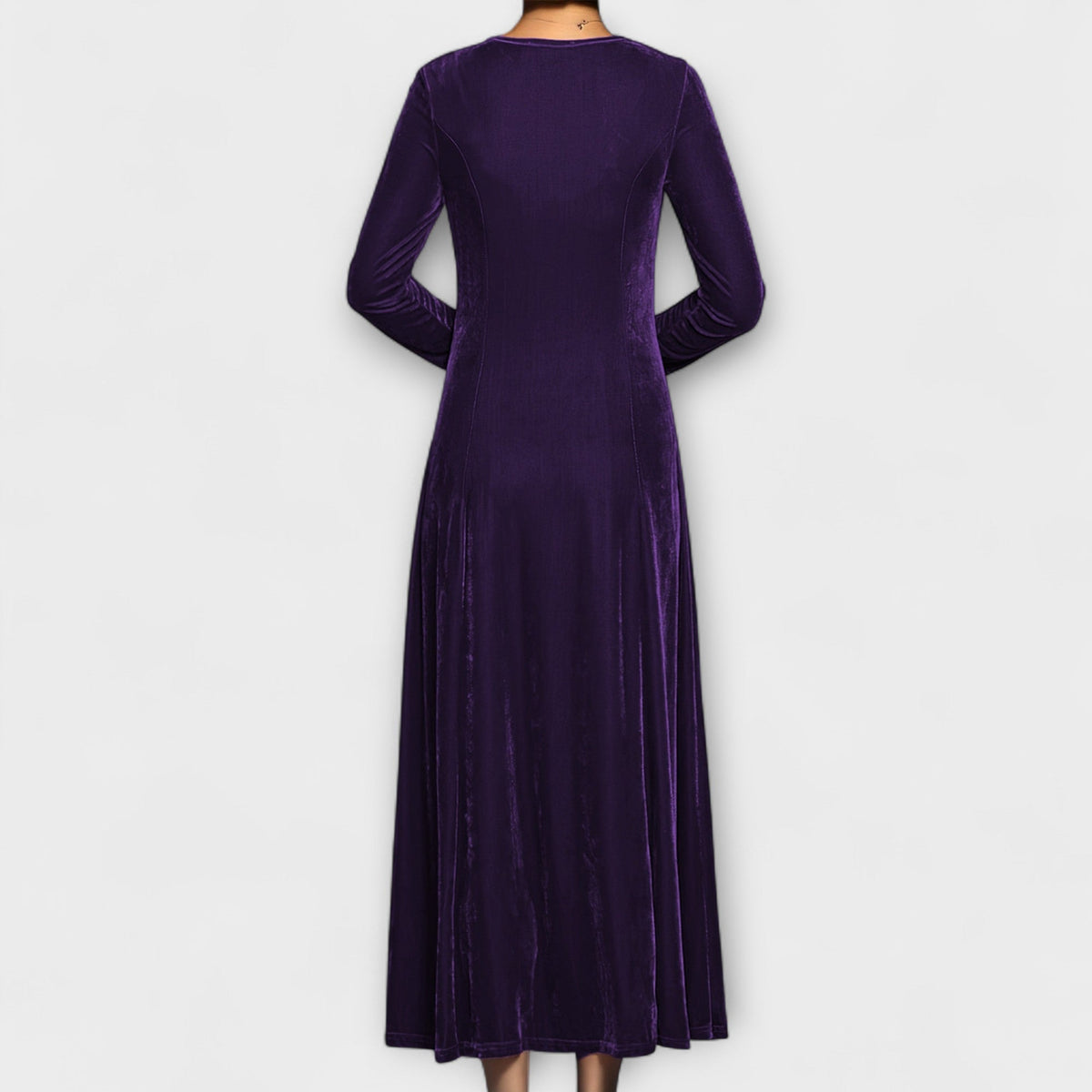 Purple soft velvet dress back view with long sleeves and midi length flowy skirt