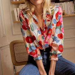 Colorful floral blouse with collared neckline and button placket