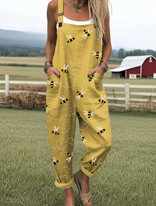 Yellow bee-print jumpsuit with spaghetti straps and front patch pockets