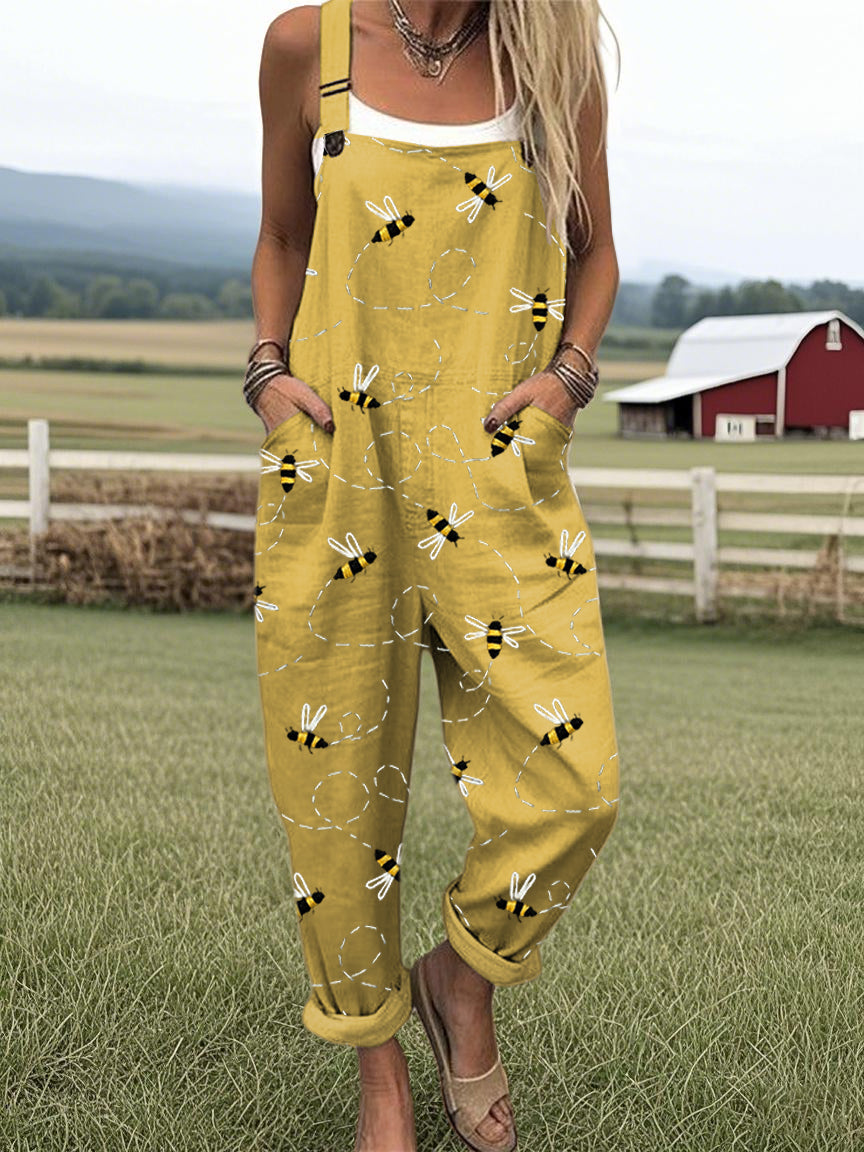 Yellow bee-print jumpsuit with spaghetti straps and front patch pockets