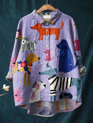 Purple button-up shirt with colorful dog and puppy prints, pointed collar, long sleeves