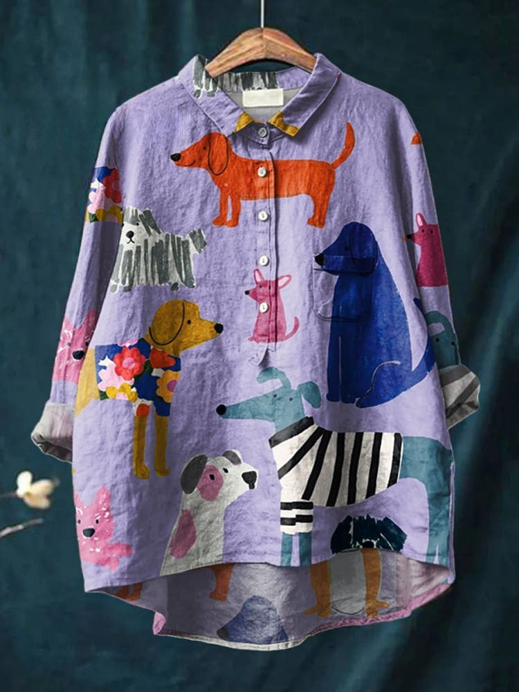 Purple button-up shirt with colorful dog and puppy prints, pointed collar, long sleeves