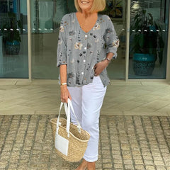 Printed button tunic top in gray with floral pattern, three-quarter sleeves