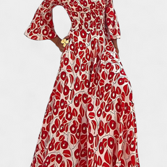 Red patterned off-shoulder maxi dress with flared sleeves and flowing tiered skirt