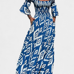 Blue patterned off-shoulder maxi dress with long flared sleeves and draped skirt