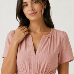 Solene dress close-up, dusty rose V-neck with short puff sleeves and smocked waist