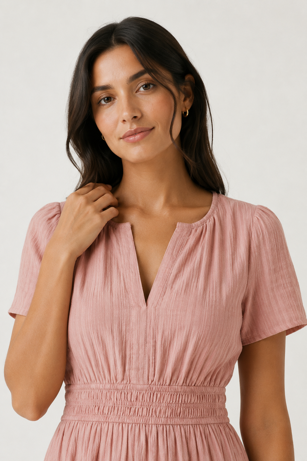 Solene dress close-up, dusty rose V-neck with short puff sleeves and smocked waist