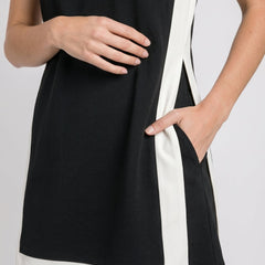 Black sleeveless dress with white hem band and side stripe detail