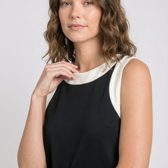 Black sleeveless dress with white crew neck and side stripe panels