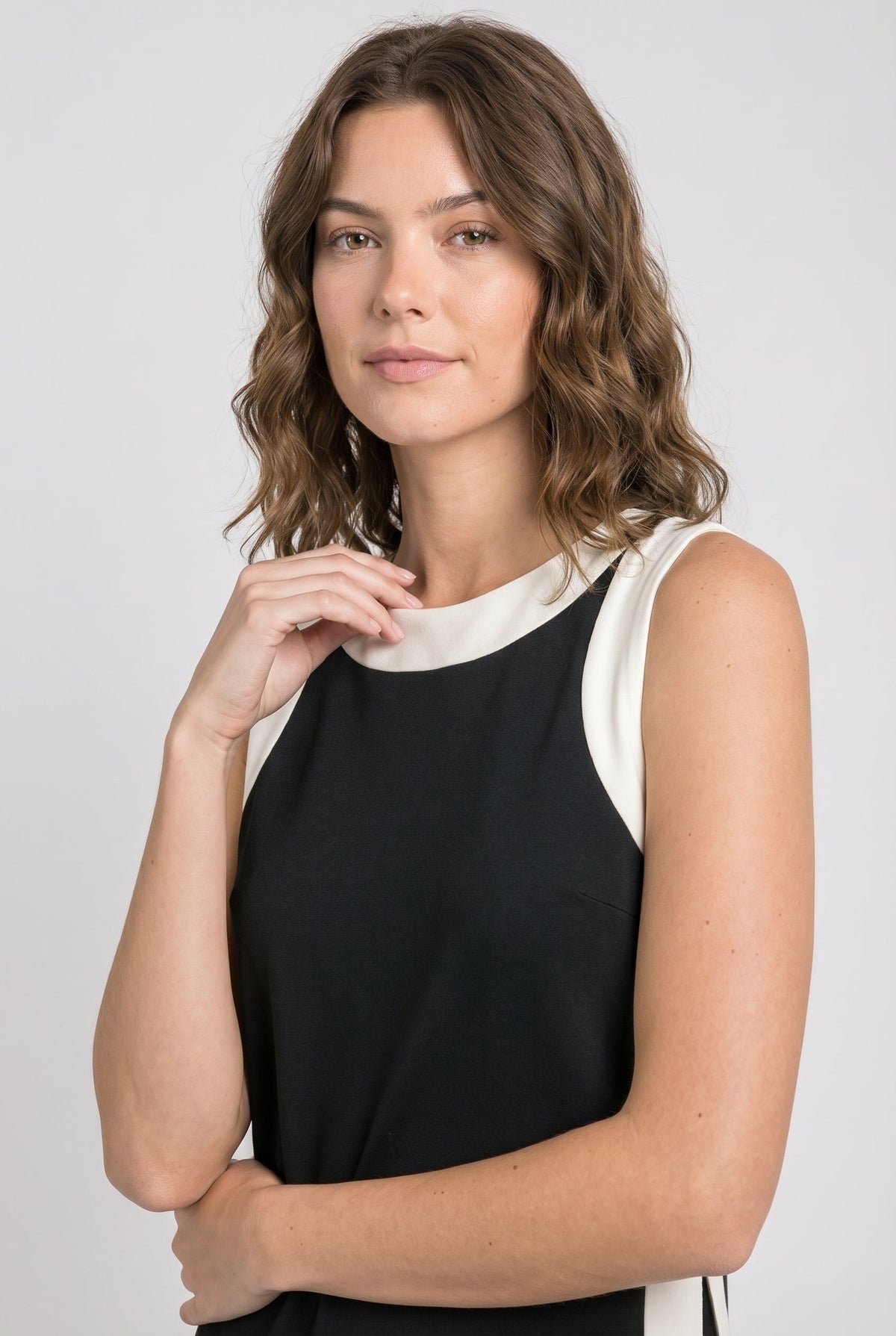 Black sleeveless dress with white crew neck and side stripe panels
