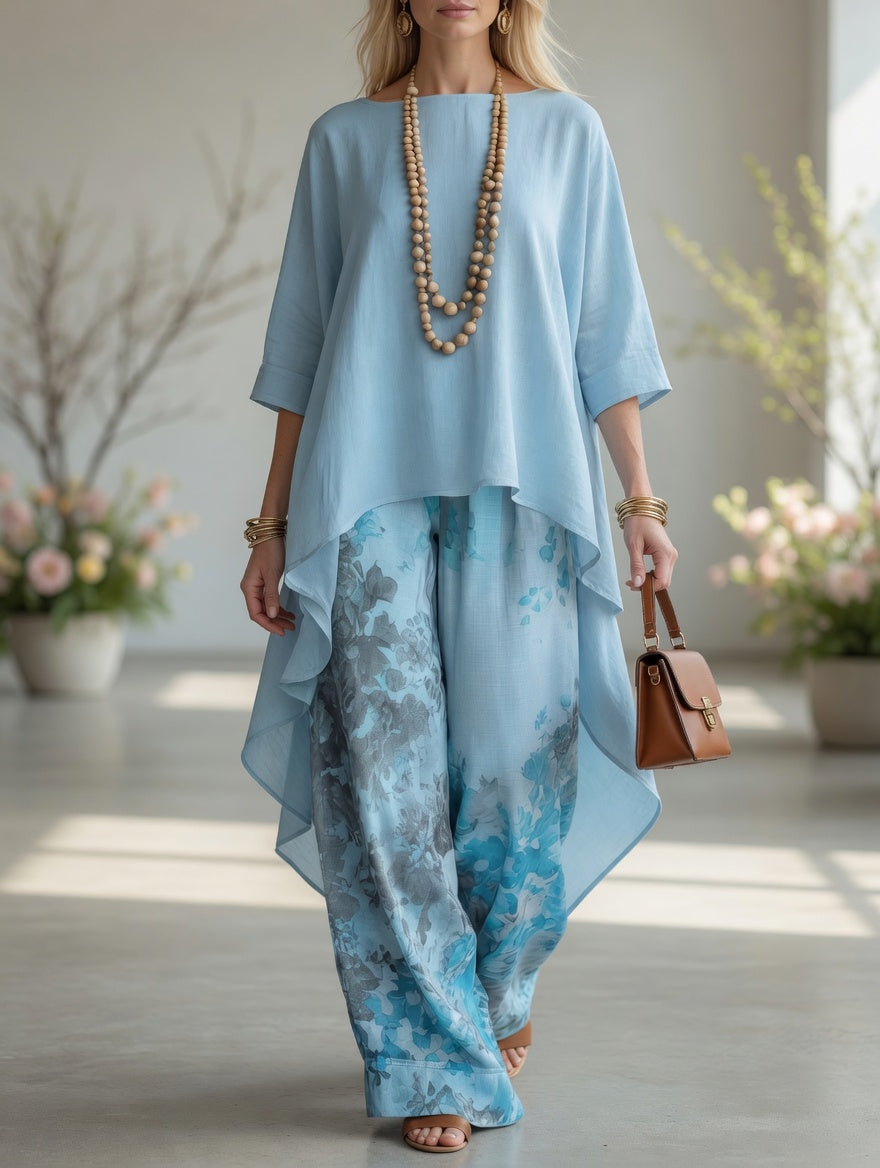 Light blue long tunic top and wide-leg printed pants set with flowy layered hems