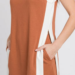 Burnt orange tunic dress with white trim border and curved side vents