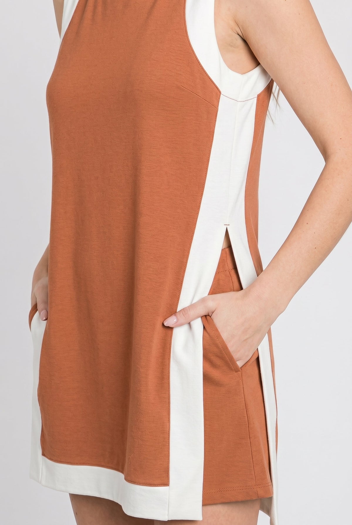 Burnt orange tunic dress with white trim border and curved side vents