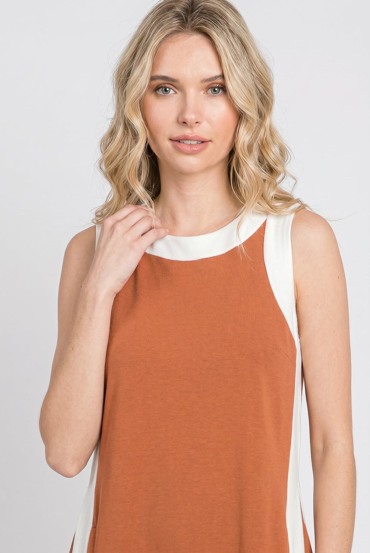Burnt orange sleeveless tunic dress with white crew neck trim and side panels
