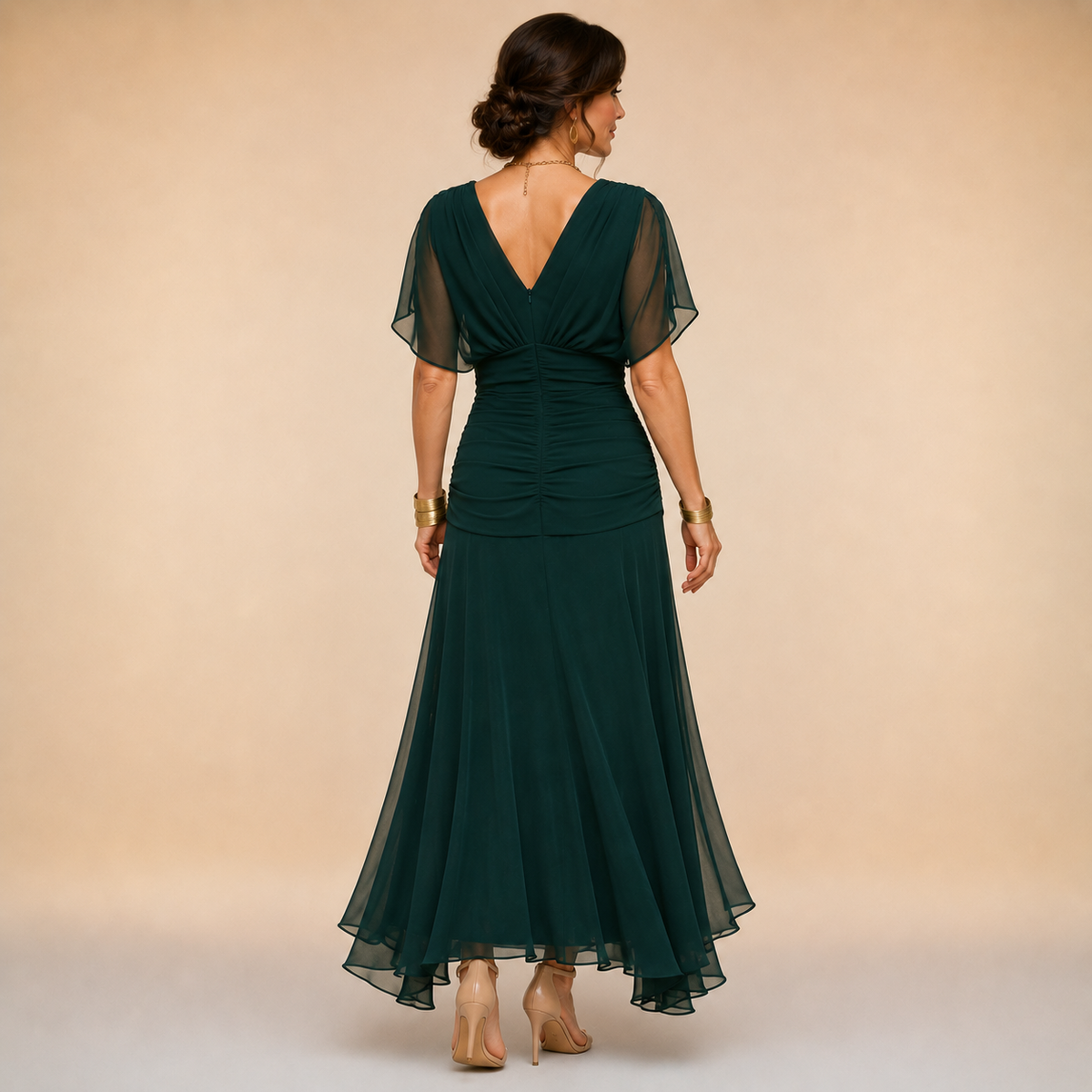Dark green back-view evening maxi dress with V-back, ruched waist, and sheer fluted skirt