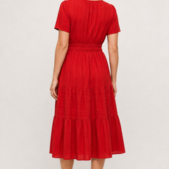 Red tiered midi dress with short sleeves and gathered waist, back view