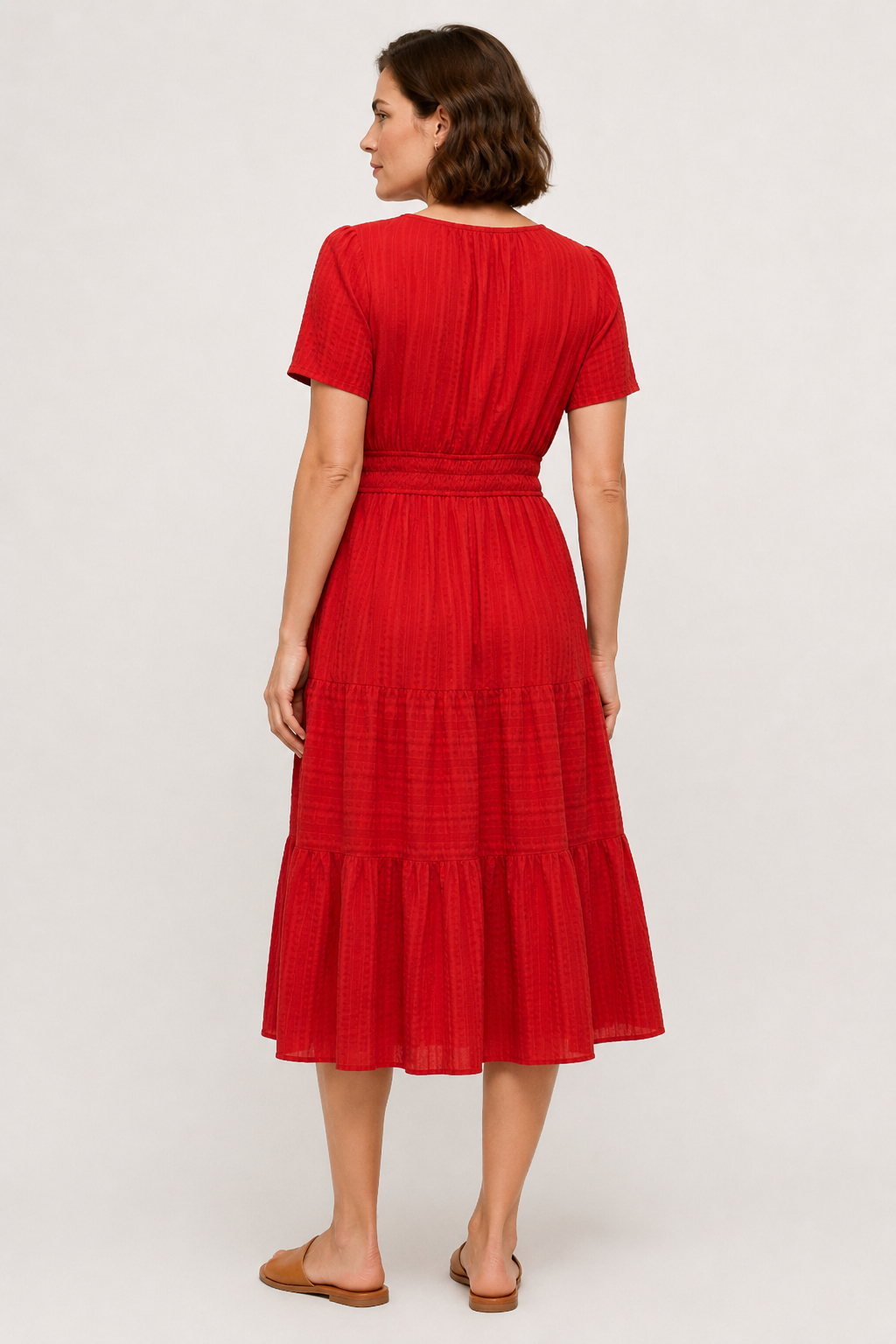 Red tiered midi dress with short sleeves and gathered waist, back view
