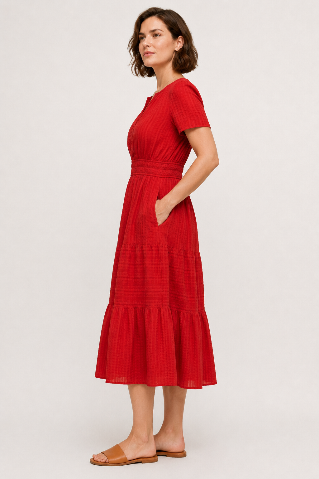 Red tiered midi dress with V-neck short sleeves and gathered waist, side view