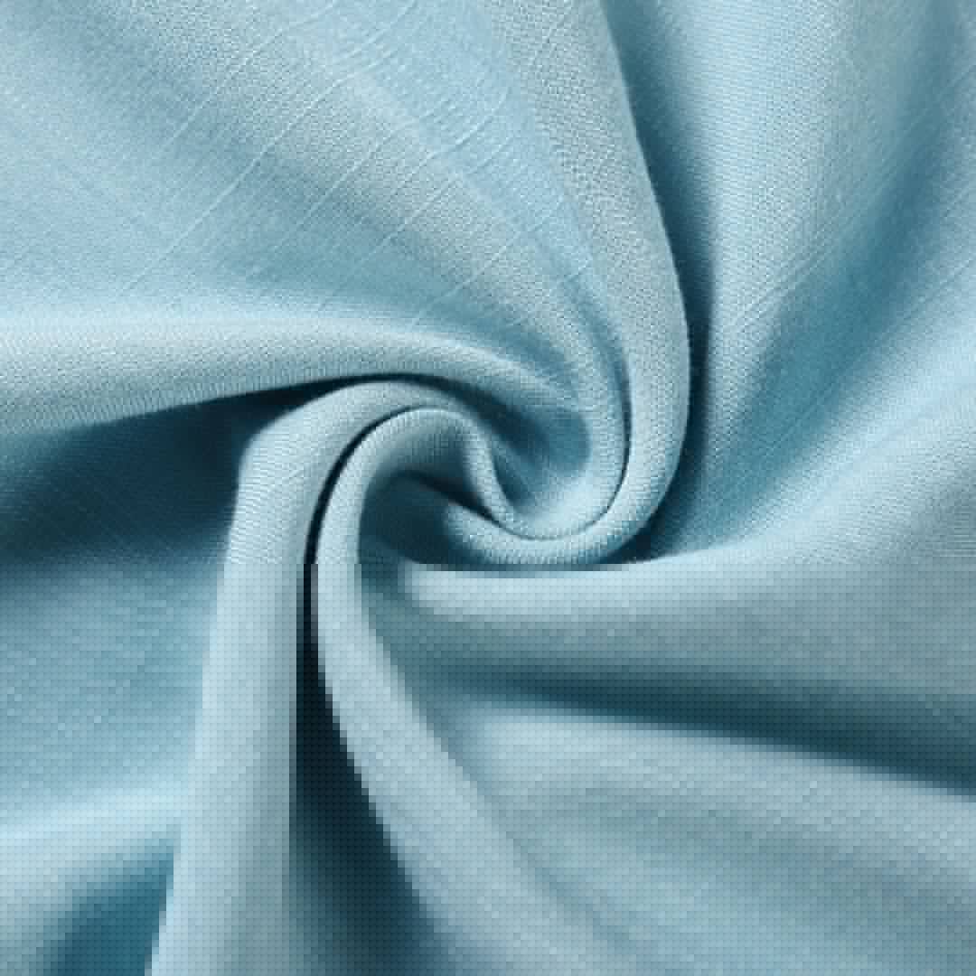 Light blue fabric close-up with soft drape texture