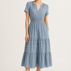 Light blue tiered V-neck midi dress with short sleeves and gathered waist