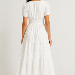 Solene dress back view in white, tiered midi hem with short sleeves and elastic waist