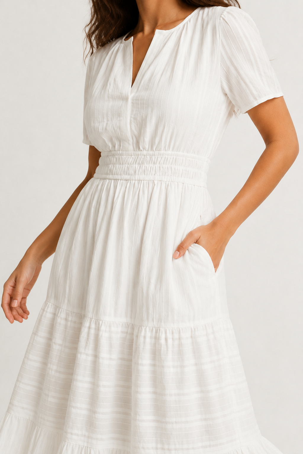 Solene dress waist and skirt detail in white, tiered layers with soft pintuck texture