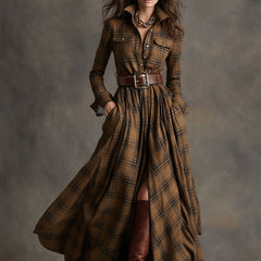 Brown plaid button-up shirt dress with collar, long sleeves, and waist belt, long hem
