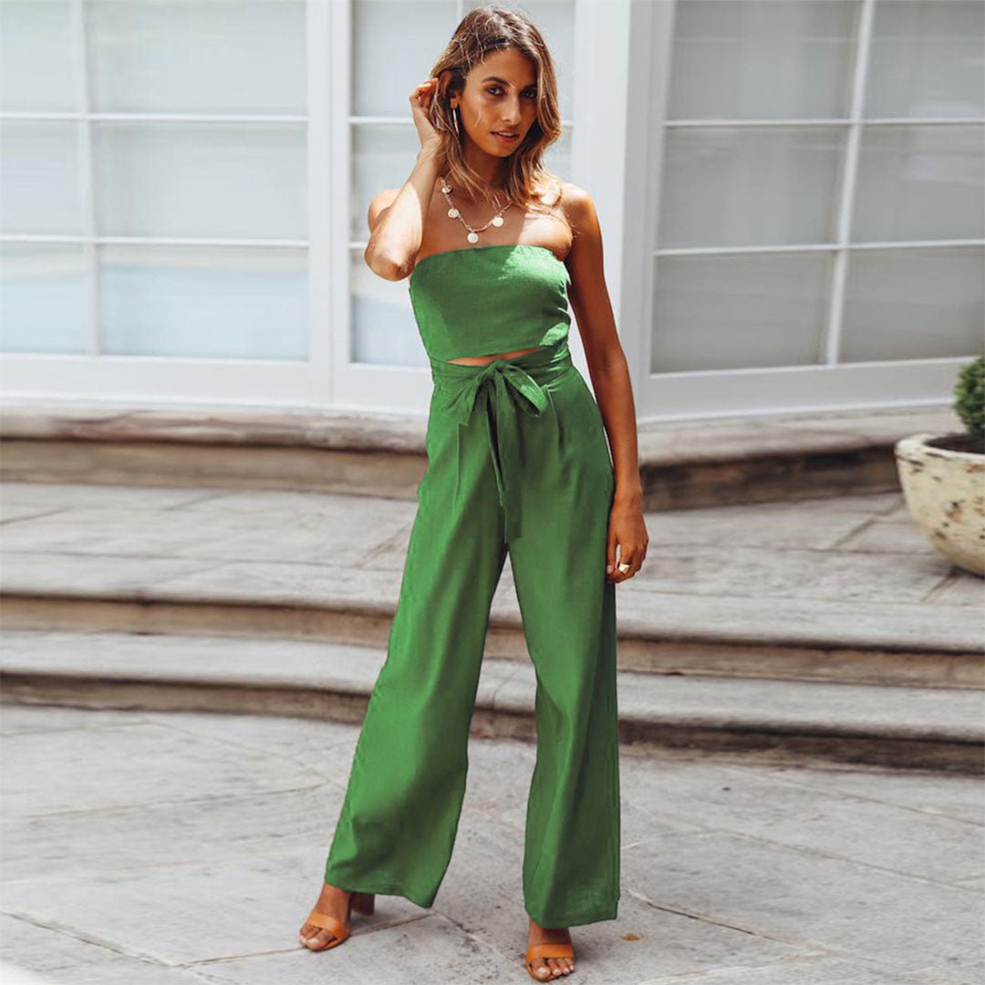 Green strapless jumpsuit with tie waist and wide-leg trousers