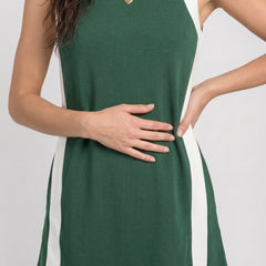 Game day set dress front, sleeveless dark green with white side panels and crew neckline