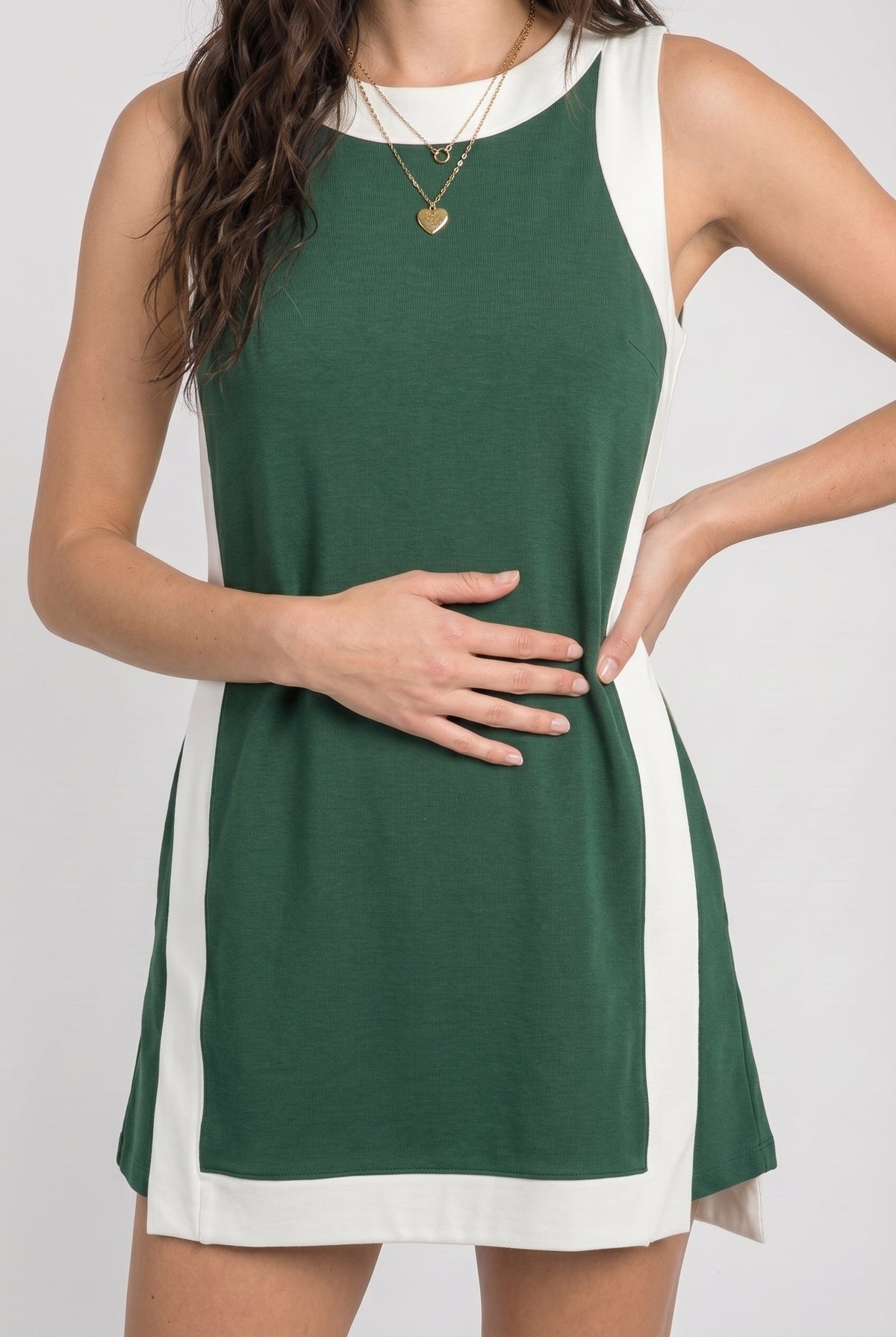 Game day set dress front, sleeveless dark green with white side panels and crew neckline