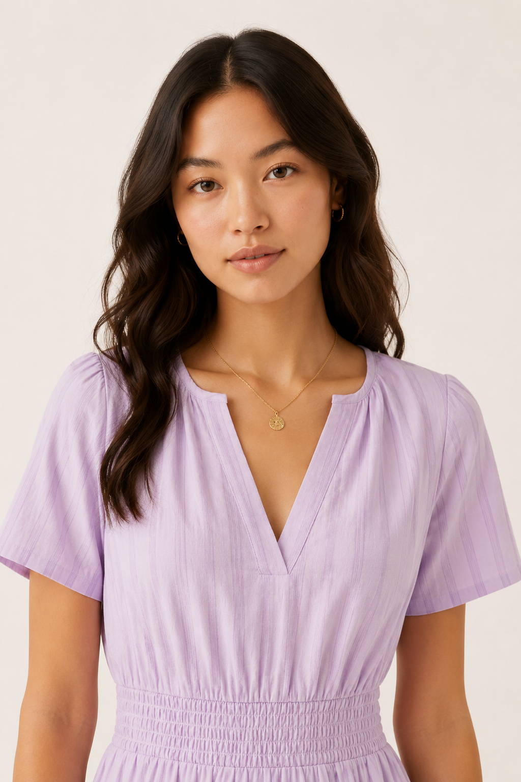 Solene dress in lavender seersucker, V-neck with smocked waist, short sleeves.