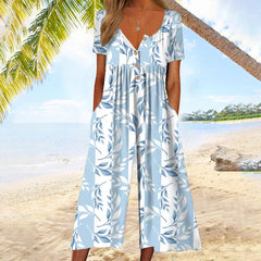Light blue floral-print jumpsuit with V-neck button front, ruffle cap sleeves, wide legs