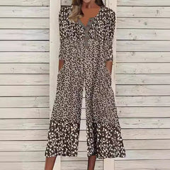 Brown and black ditsy floral jumpsuit with V-neck button front, short sleeves, wide legs