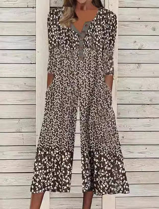 Brown and black ditsy floral jumpsuit with V-neck button front, short sleeves, wide legs