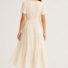 Solene dress back view in light cream, tiered midi skirt, short sleeves, elastic waist