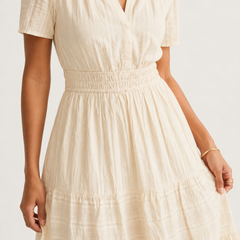 Solene dress bodice and skirt detail in light cream, tiered ruffles with gathered waist