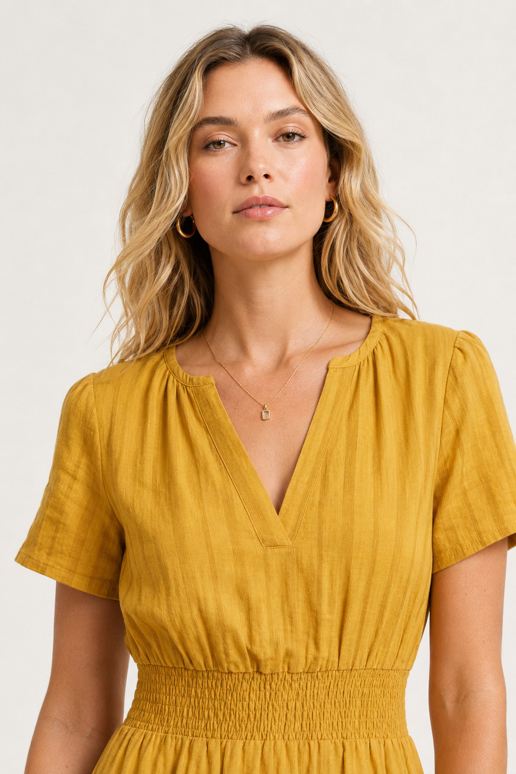 Mustard yellow V-neck midi dress with short sleeves and elastic waist detail