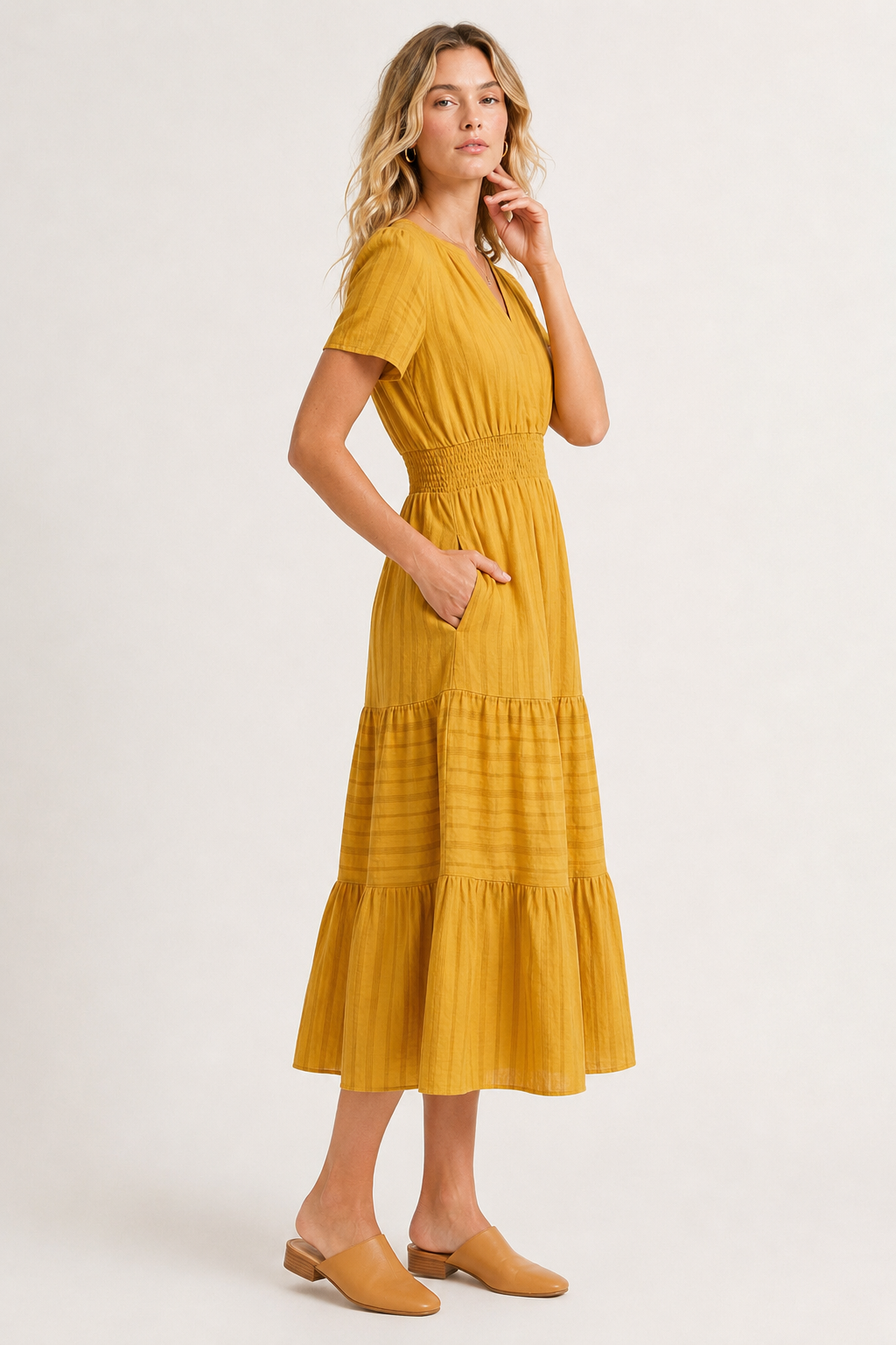 Mustard yellow V-neck tiered midi dress with short sleeves and gathered waist