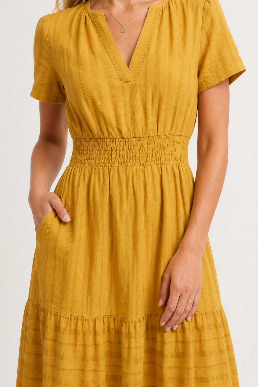 Mustard yellow V-neck tiered midi dress with short sleeves and gathered waist