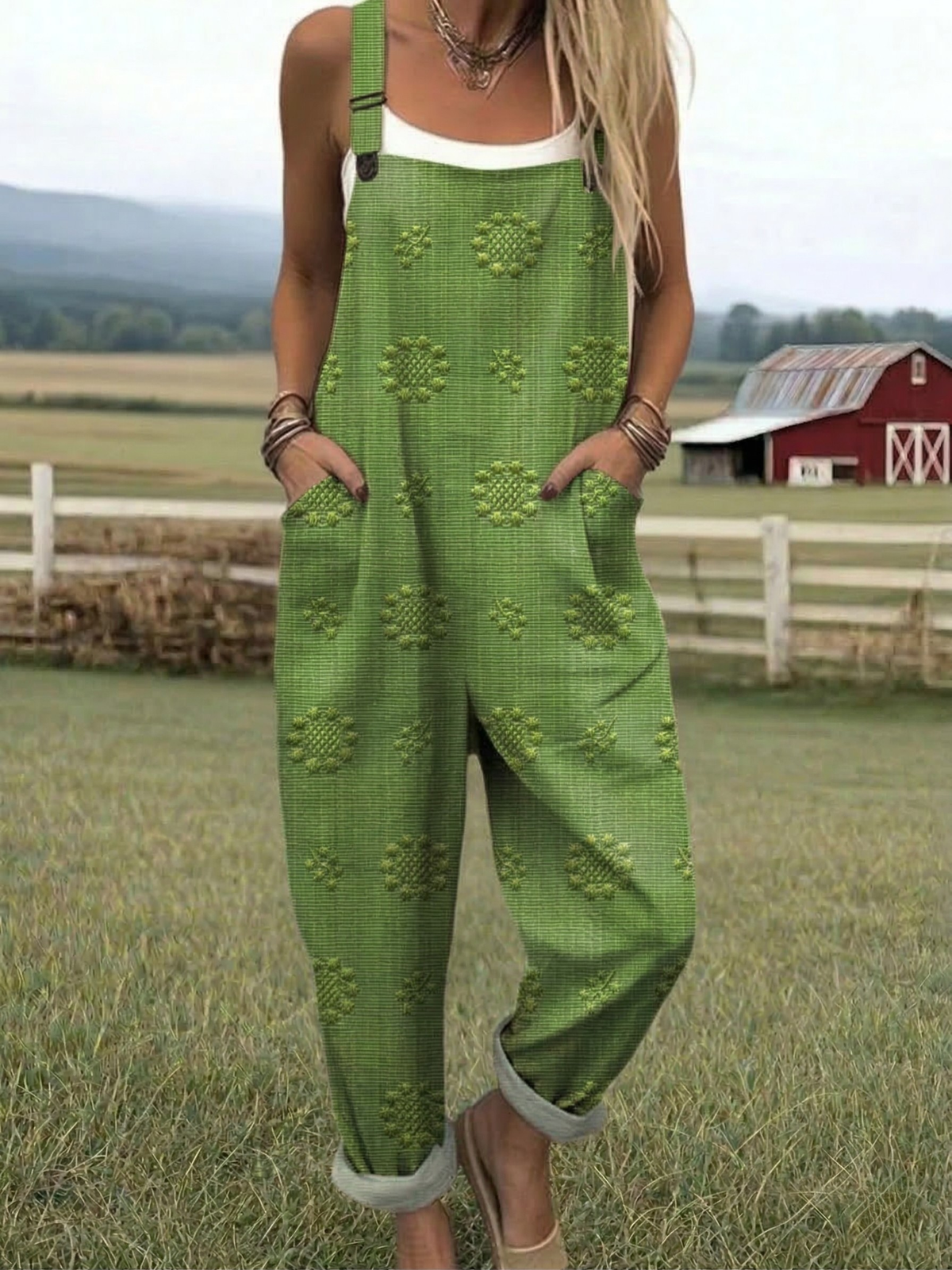 Green relaxed jumpsuit with embroidered floral pattern, wide-leg bib overalls